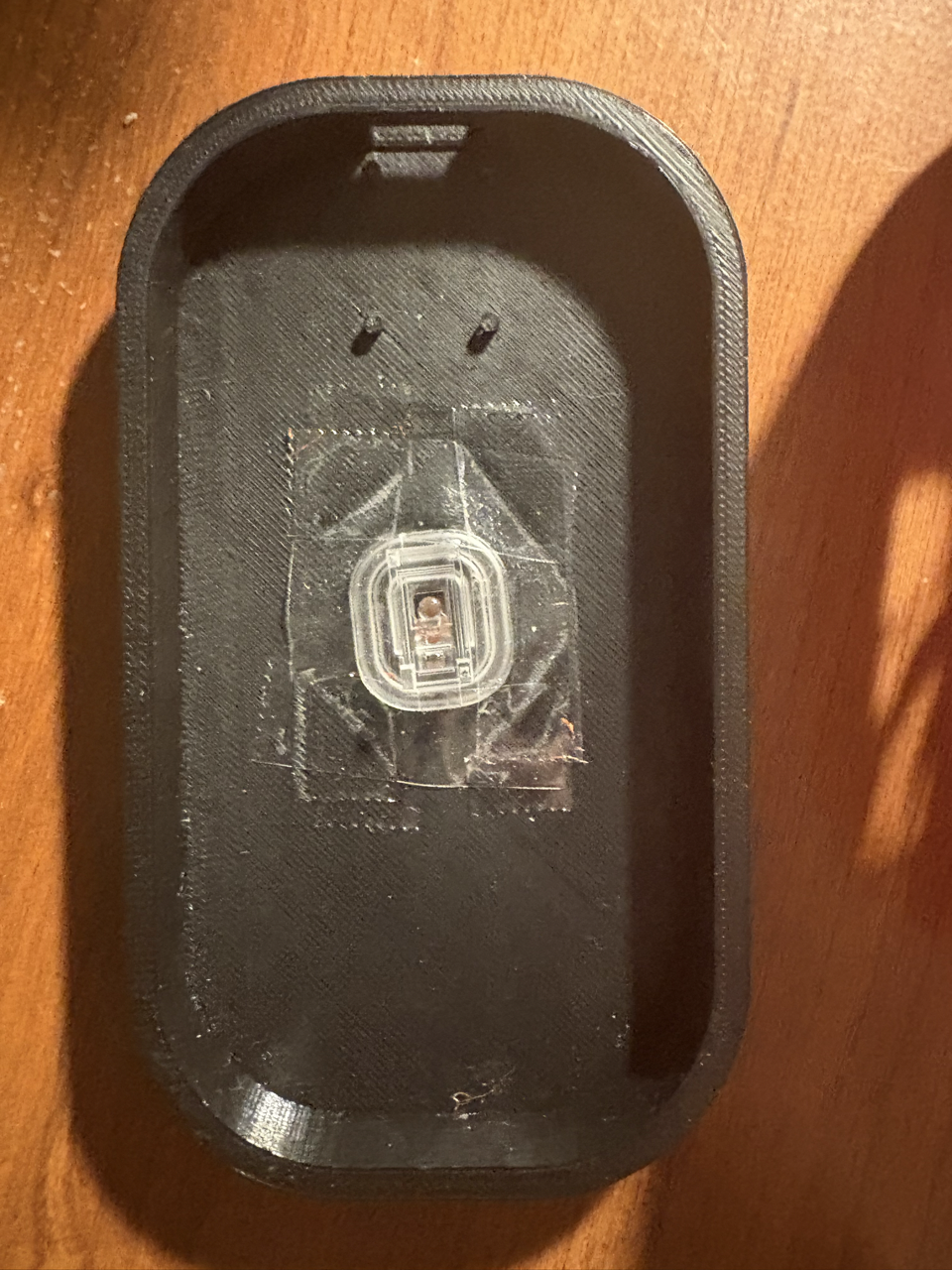 The base piece with lens.